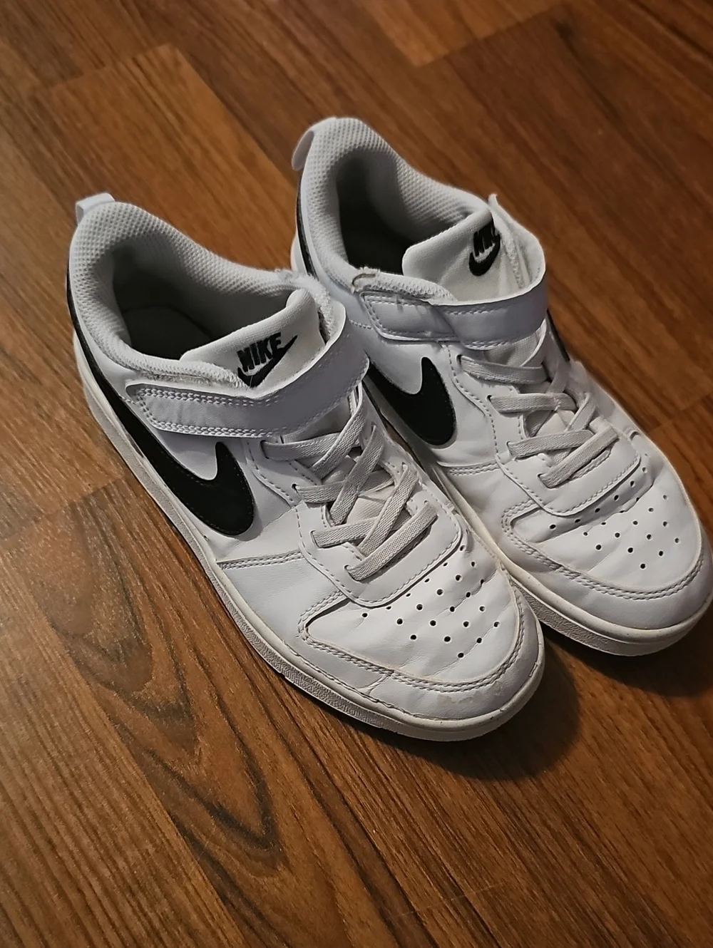 Nike Kids White Sneakers with Black Swoosh